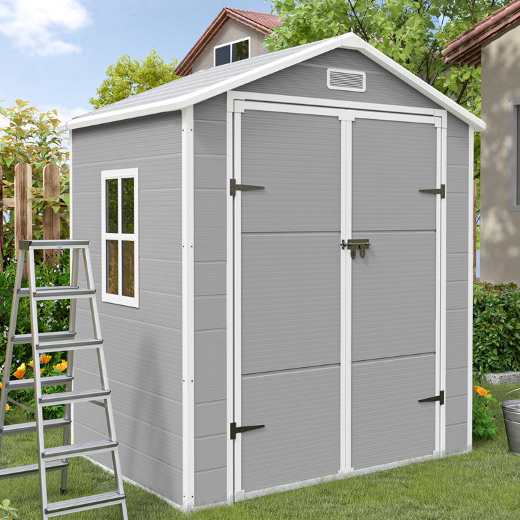 Outdoor resin storage shed with floor